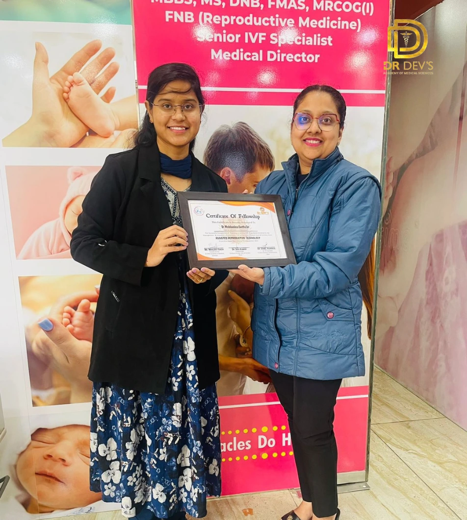 Dr Dev's academy's teacher giving the certificate to the student